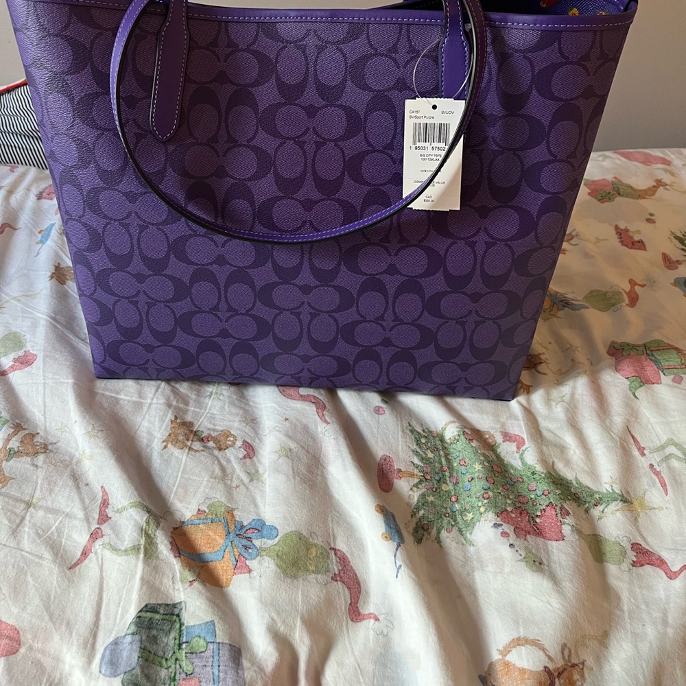 Beautiful purple coach city tote with floral interior.